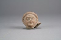 Lot 164 - An Egyptian terracotta head of a child,...