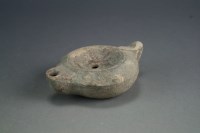 Lot 167 - A Roman pottery lamp, circa 2nd Century AD, of...