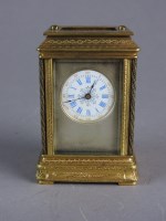 Lot 187 - A French brass miniature timepiece with five...