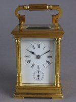 Lot 202 - A gilt brass cased carriage alarm clock with...