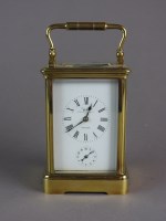 Lot 212 - A gilt brass cased carriage alarm clock, the...