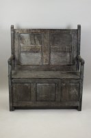 Lot 227 - An oak panel back settle, 18th century and...