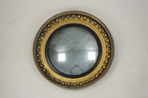 Lot 233 - A Regency convex wall mirror, early 19th...
