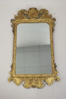 Lot 247 - A George III carved gilt wood wall mirror, the...