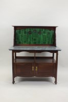 Lot 251 - An Arts and Crafts mahogany three piece...
