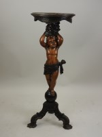 Lot 255 - A Venetian carved walnut figural torchere...