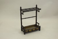 Lot 285 - An Edwardian simulated bamboo framed stick...
