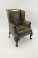 Lot 286 - A George III style mahogany framed wing back...