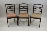 Lot 306 - A set of five Regency mahogany sabre leg...