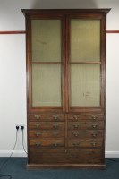 Lot 309 - A walnut gun cabinet, early 20th century, the...