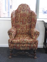 Lot 313 - A continental wing back armchair, 19th century,...