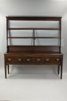 Lot 315 - A George III oak dresser and rack, late 18th...