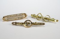 Lot 4 - A seed pearl set bar brooch, together with two...
