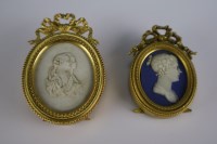 Lot 9 - Two gilt metal mounted oval cameos with easel...