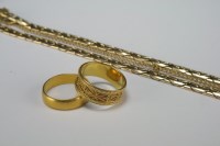 Lot 13 - A 22ct gold plain polished wedding band,...