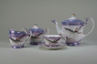 Lot 52 - A Japanese Dragonware purple lustre tea...