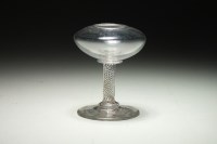 Lot 99 - A George III glass lace makers lamp with squat...