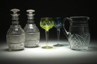 Lot 105 - A pair of cut and faceted glass decanters and...