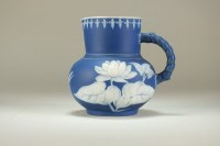 Lot 109 - A 19th century jasperware jug of low-bellied...