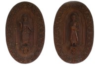 Lot 140 - A pair of Indian carved hardwood figural oval...