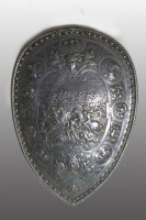 Lot 150 - A cast white metal shield with battle scene...