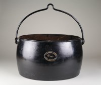 Lot 151 - A black painted cauldron