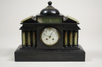 Lot 291 - A black marble and onyx mantel clock