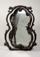 Lot 302 - A mid Victorian rosewood mirror in Rococo...