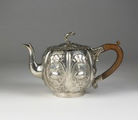 Lot 31 - A continental silver teapot, the body of melon...