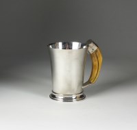 Lot 40 - A Goldsmiths & Silversmiths Co Ltd silver mug,...