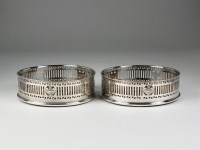 Lot 62 - A pair of silver mounted wine coasters, Harry...