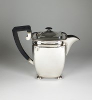 Lot 76 - A white metal hot water jug, of tall...