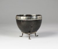 Lot 116 - A mid 18th century white metal mounted coconut...