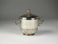 Lot 117 - A two handled white metal cup and cover, the...