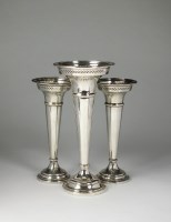Lot 126 - A garniture of three silver mounted posy vases,...
