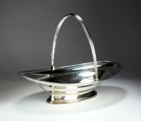 Lot 129 - A George III silver cake basket, John Emes,...