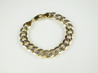 Lot 165 - A yellow and white gold decorative curb link...