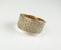 Lot 172 - A 9ct gold diamond set panel ring, the eight...