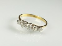 Lot 173 - A graduated diamond ring, the five old cut...
