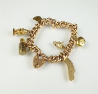 Lot 176 - A yellow metal hollow curb link bracelet, with...