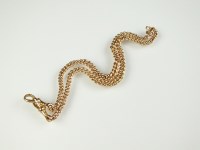 Lot 177 - A 9ct gold graduated curb link Albert, with...