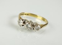 Lot 180 - An 18ct gold three stone diamond ring, the...