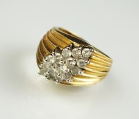 Lot 192 - A diamond set dress ring, designed as a...