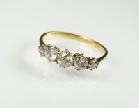 Lot 194 - A five stone graduated diamond ring, the five...