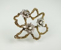 Lot 198 - An 18ct gold diamond set brooch, designed as...