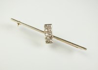 Lot 200 - A diamond bar brooch, designed as a...