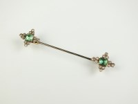 Lot 204 - An emerald and diamond stick pin, designed as...