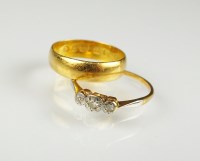 Lot 214 - A 22ct gold wedding band, ring size K 1/2,...