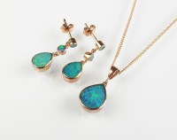 Lot 219 - A 9ct rose gold boulder opal pendant, the tear...