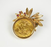 Lot 223 - A 1968 sovereign brooch, within 9ct gold ruby...